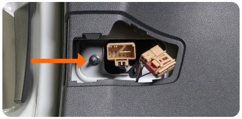 Arrow pointing to the 8mm nut holding the inner tail light, visible through the hatch access opening