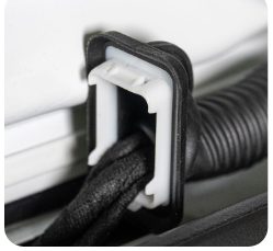 Close-up of the hatch wiring loom grommet released from its square opening