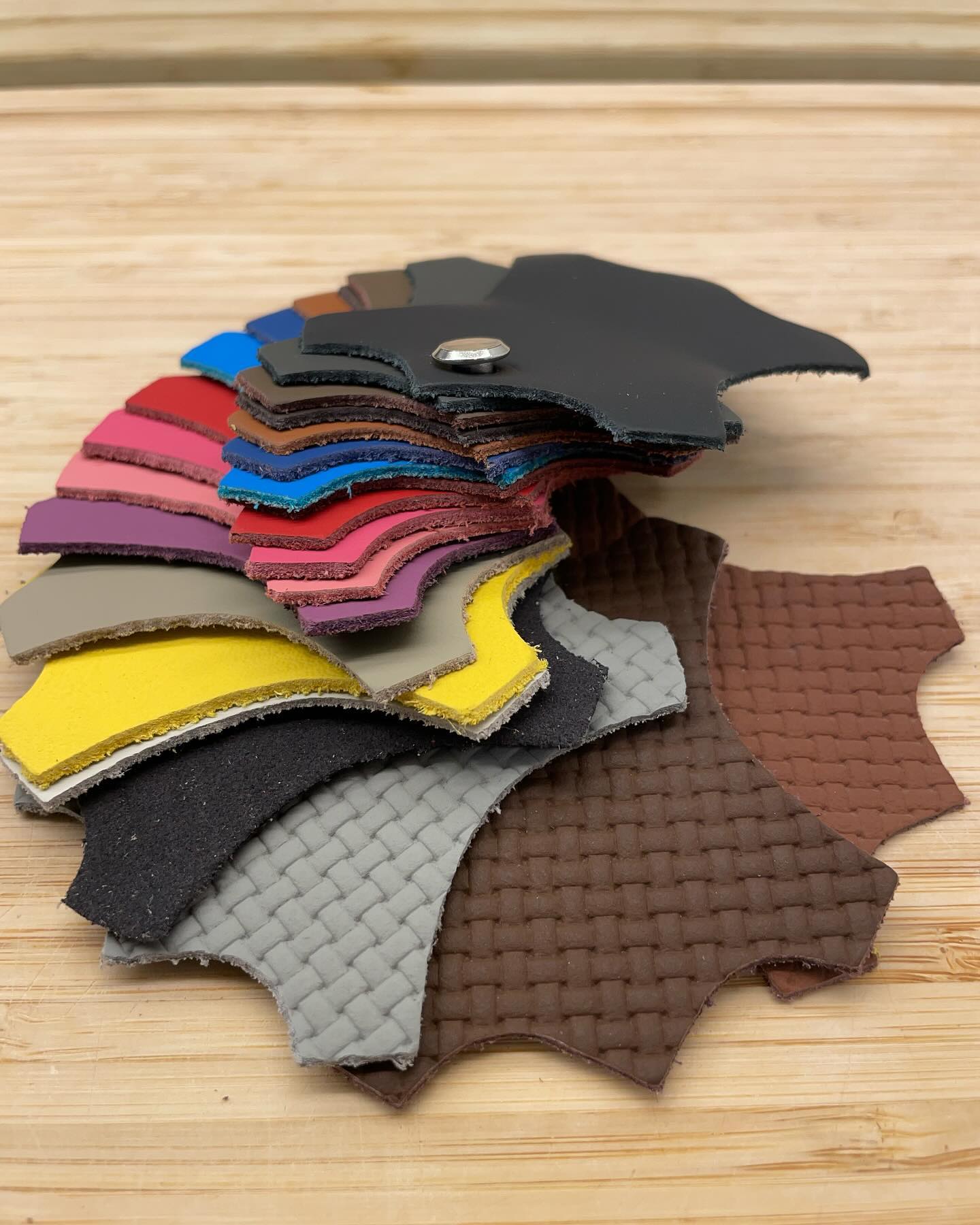 Genuine Alcantara material samples in a range of colours and stitch patterns